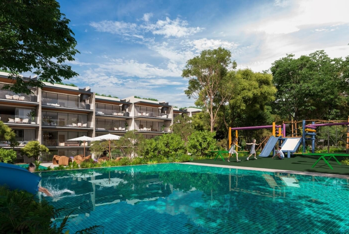 a pool with a slide and a building in the background