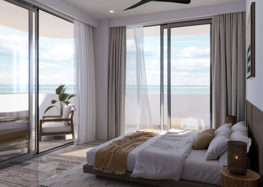 a bedroom with a large window overlooking the ocean